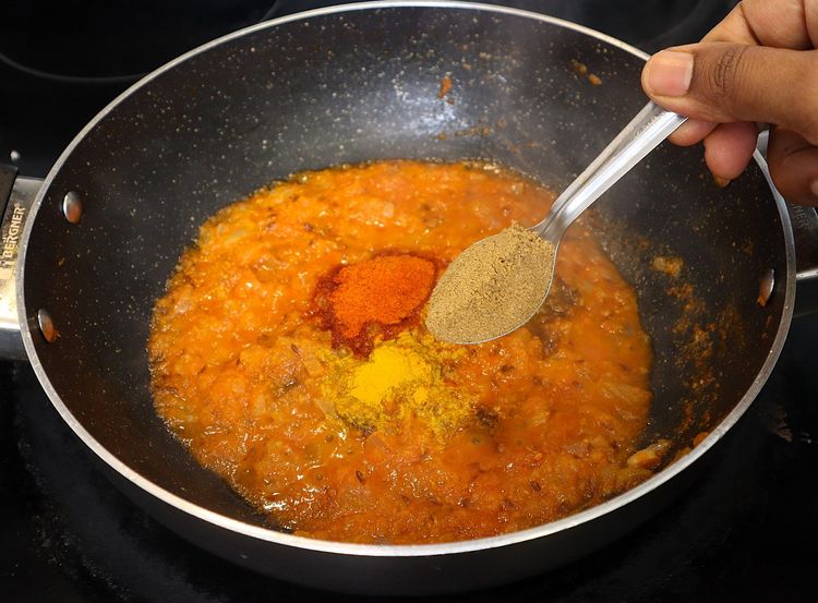 Step 2.3: * Furthermore keeping the flame on low, add ¼ tsp turmeric, 1 tsp chilli powder, 1 tsp coriander powder, ½ tsp cumin powder, ½ tsp garam masala and 1 tsp salt