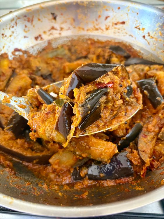 Step 5.2: Add the coarse red chilli–coconut mixture, mix gently, cover, and simmer for another 4–5 minutes for the flavours to come together
