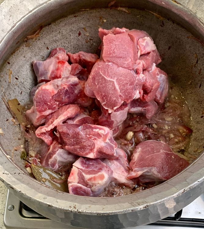 Step 1.1: Stir in the mutton and cook until it changes colour and the oil separates from the wok