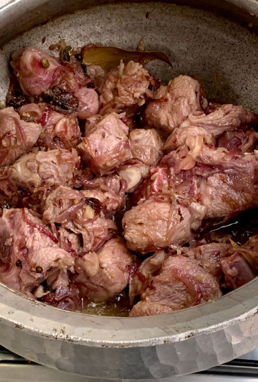 Step 1.2: Stir in the mutton and cook until it changes colour and the oil separates from the wok