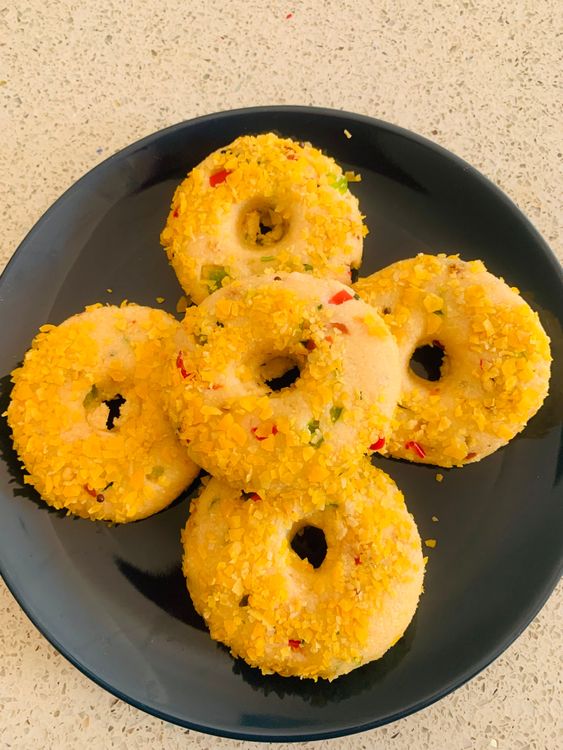 Step 2.2: Coat each vada with coarsely ground cornflakes, pressing slightly to ensure the cornflakes stick