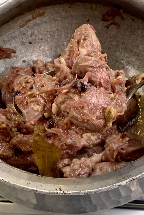 Step 1.3: Stir in the mutton and cook until it changes colour and the oil separates from the wok