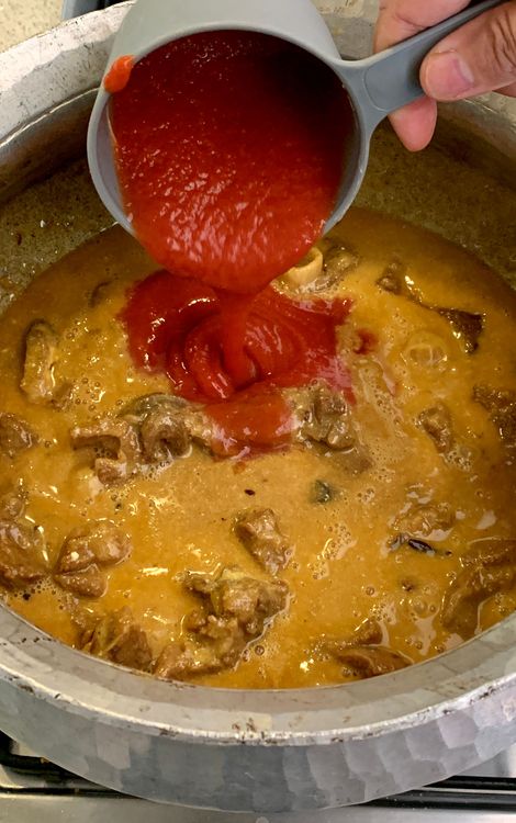 Step 1.1: Mix in the tomato puree, lemon juice