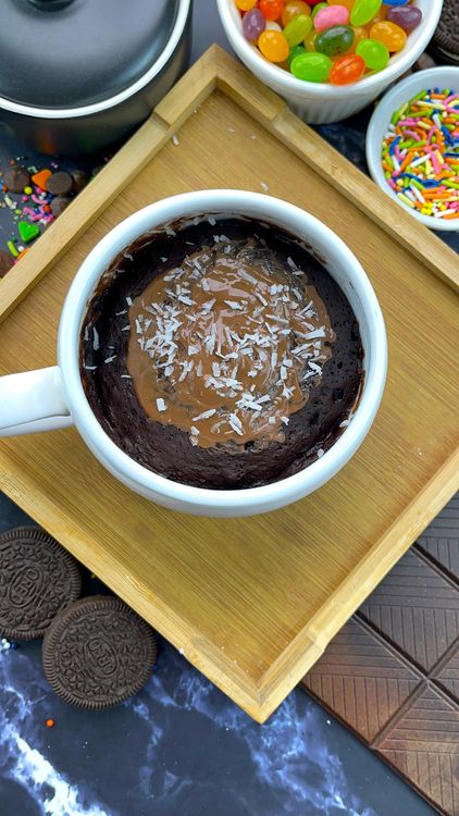 Step 1.1: Sprinkle extra desiccated coconut on top for garnish and enjoy your Bounty Bar Mug Cake!
