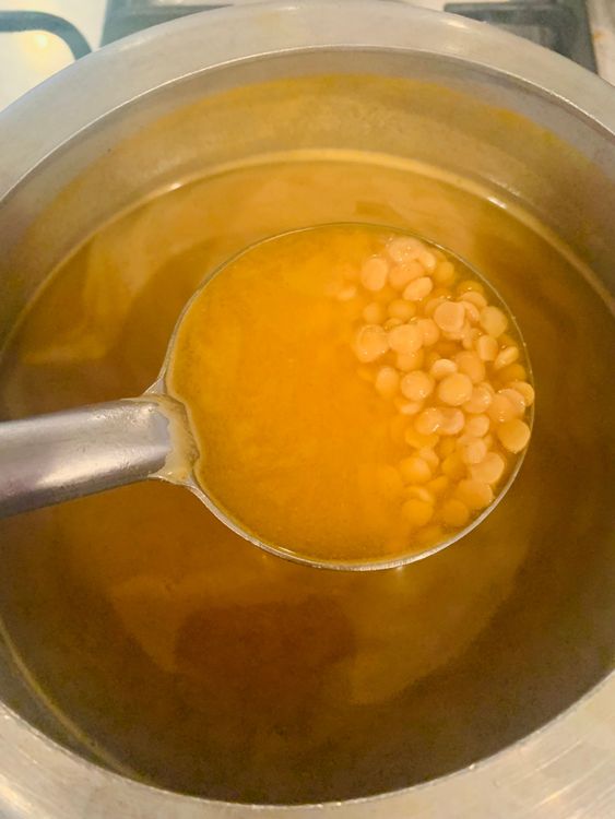Step 1.1: Add the washed dal to a pressure cooker along with water, red chilli powder, turmeric powder, and salt to taste