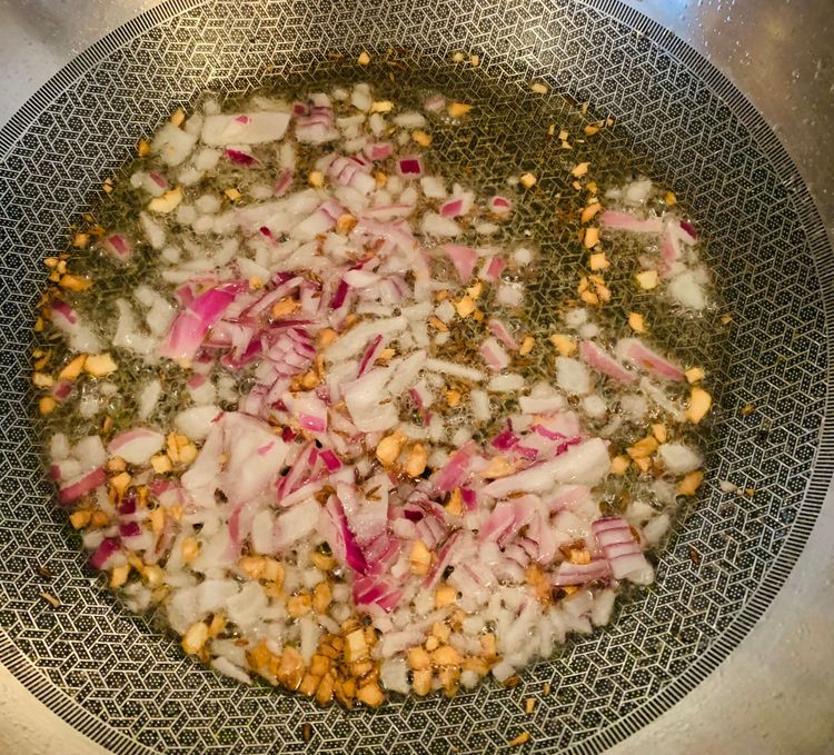 Step 2.1: Add the finely chopped onions and cook until they turn golden brown