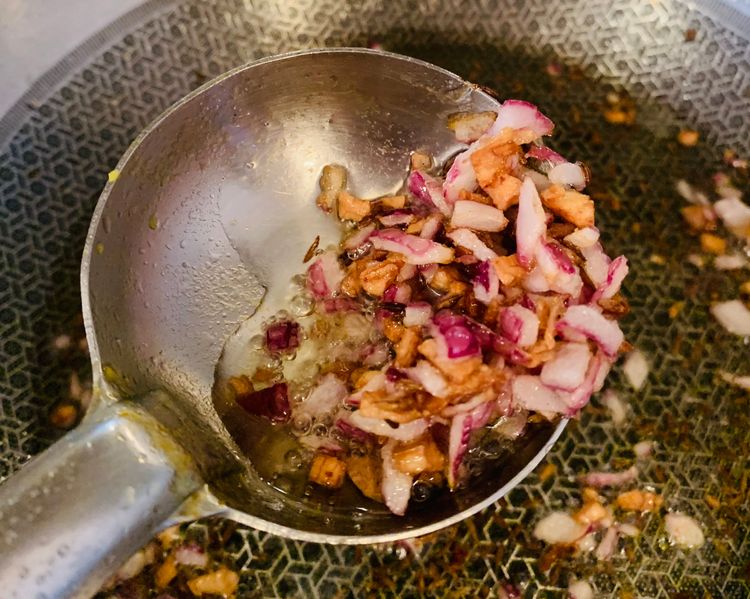 Step 2.2: Add the finely chopped onions and cook until they turn golden brown