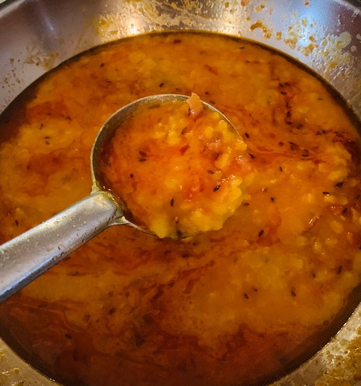 Step 3.1: Add the boiled dal and lemon juice to the pan with the tempering mixture