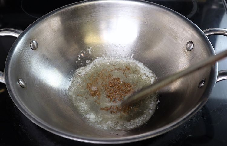 Step 3.3: Add cumin seeds and sauté until fragrant