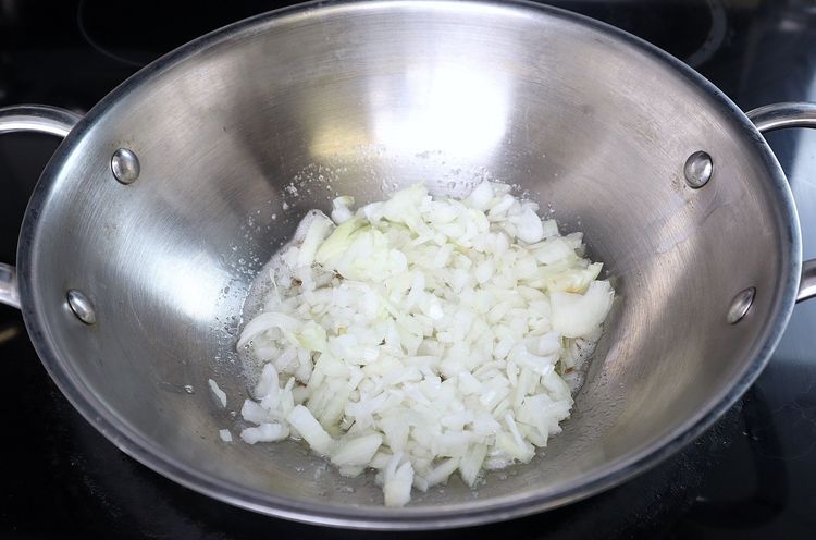 Step 3.2: Add finely chopped onions and roast until they turn light golden in color