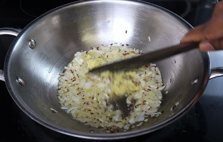 Step 3.2: Add ginger and garlic paste and sauté until the raw smell disappears