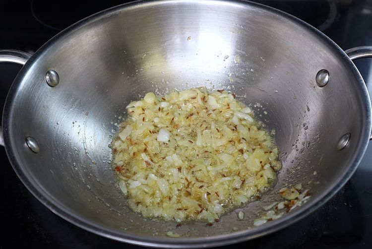 Step 3.3: Add ginger and garlic paste and sauté until the raw smell disappears