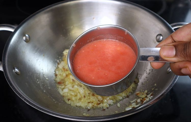 Step 3.1: Add tomato puree and cook until oil releases from the curry