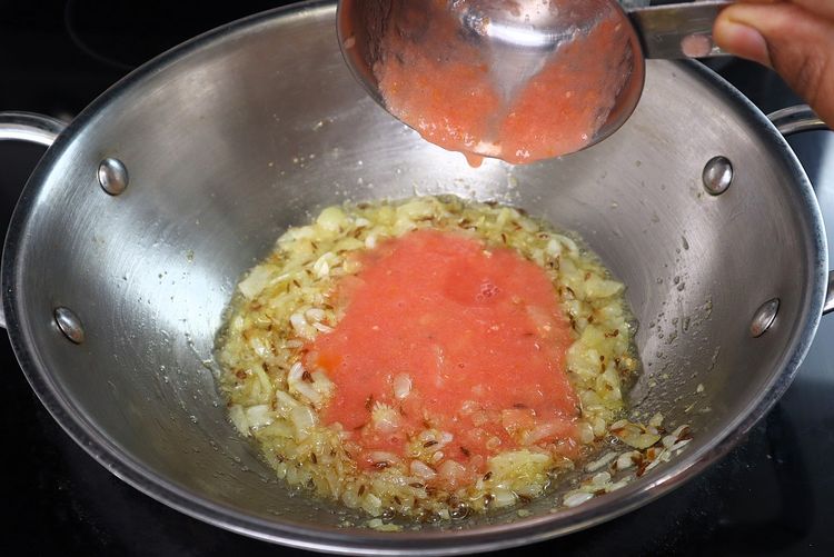 Step 3.2: Add tomato puree and cook until oil releases from the curry