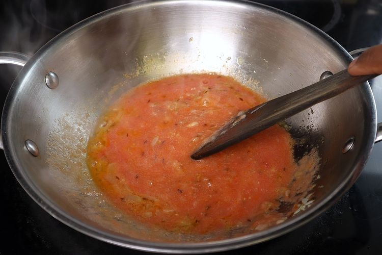 Step 3.3: Add tomato puree and cook until oil releases from the curry