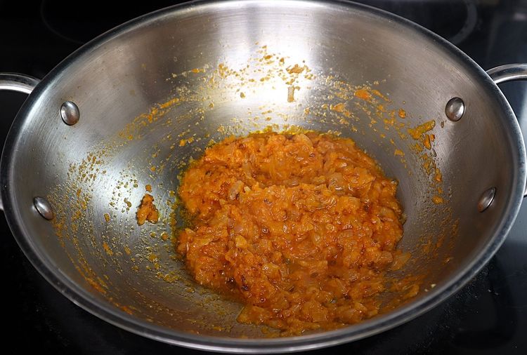Step 3.5: Add tomato puree and cook until oil releases from the curry