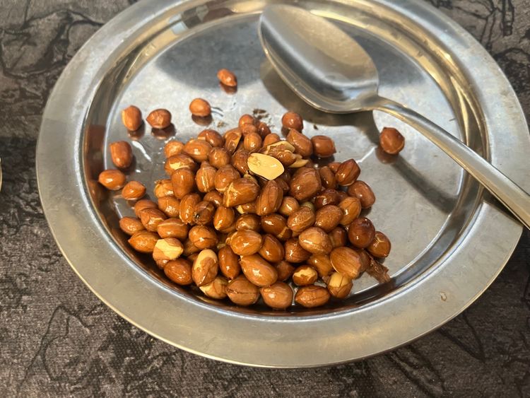 Step 4.2: Add peanuts and fry until golden