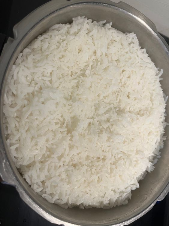 Step 6.1: Spread cooked rice on a large plate to cool slightly