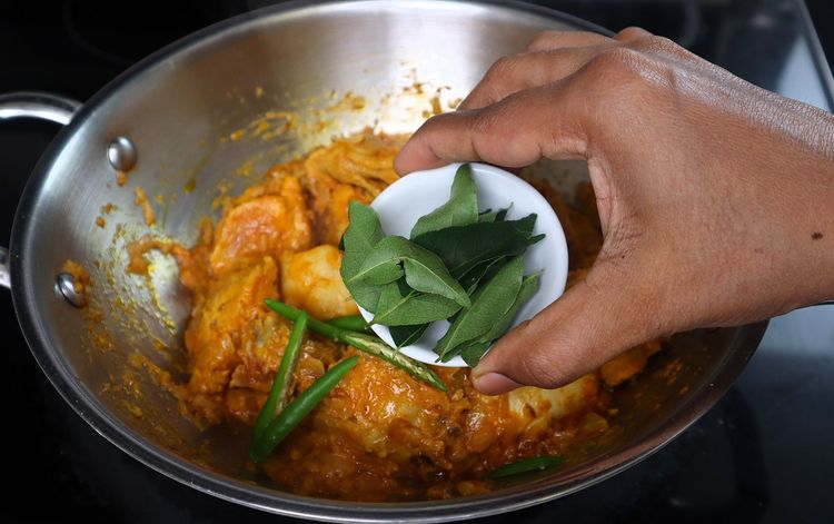 Step 3.2: Add slit green chilies, curry leaves, mint leaves, and the ground masala powder