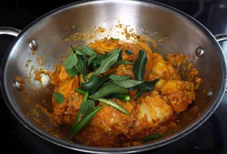 Step 3.4: Add slit green chilies, curry leaves, mint leaves, and the ground masala powder