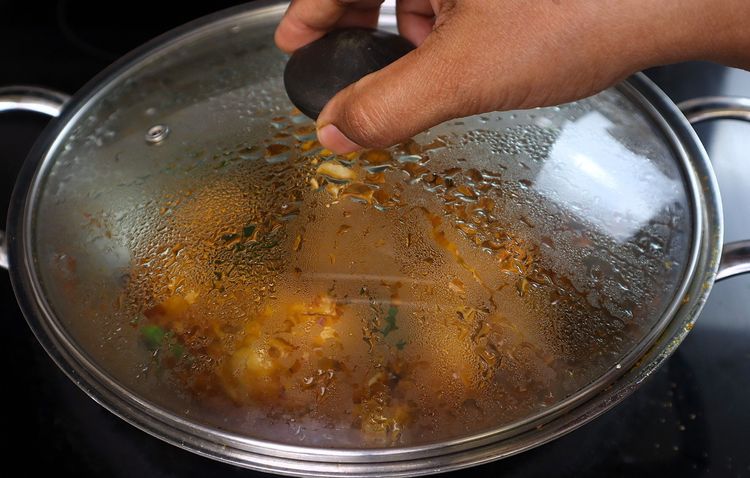 Step 3.3: Cover and cook for 5 minutes until oil releases