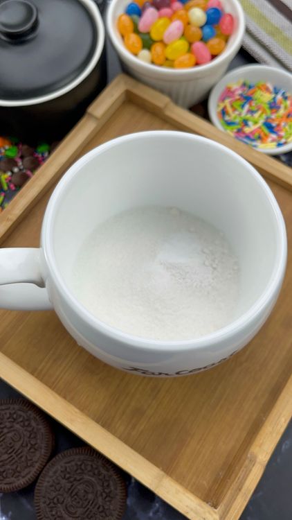 Step 1.1: In a microwave-safe mug, add flour, sugar, baking powder, baking soda, and salt