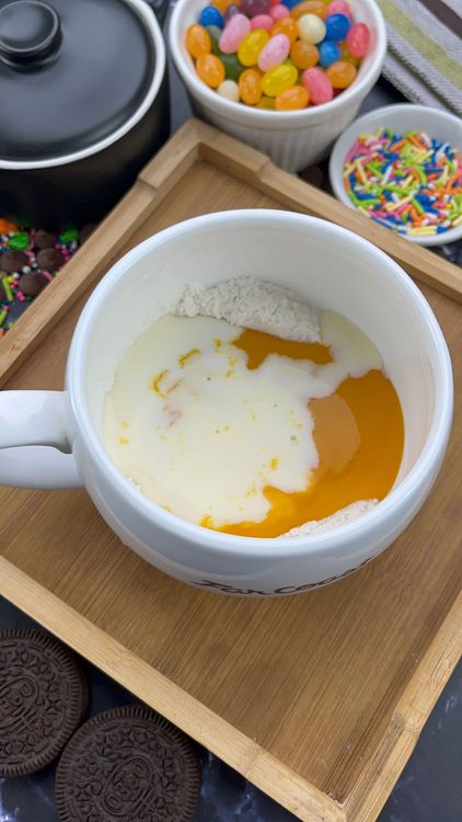 Step 2.1: Pour in mango purée, milk, oil, vanilla extract, and lemon juice (if using)