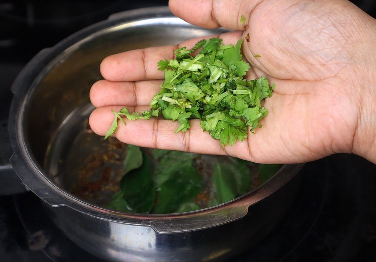 Step 1.2: Add curry leaves and coriander leaves