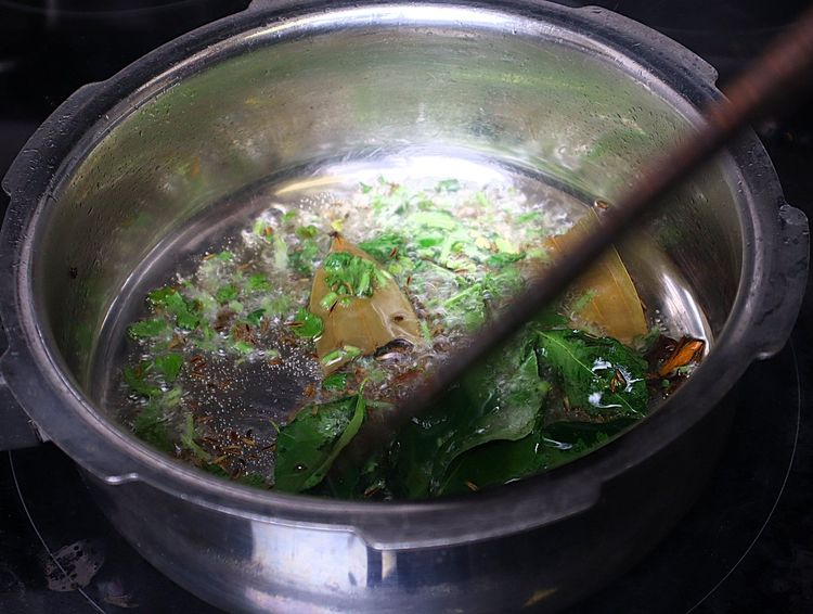 Step 1.4: Add curry leaves and coriander leaves