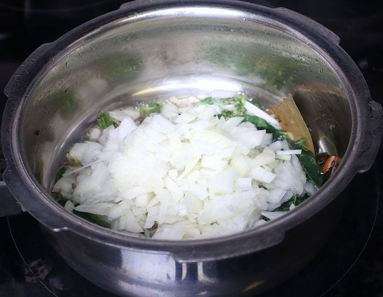 Step 1.2: Add sliced onions and sauté until they are soft and change color
