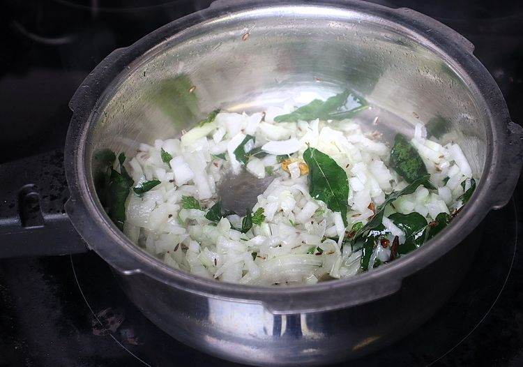 Step 1.3: Add sliced onions and sauté until they are soft and change color