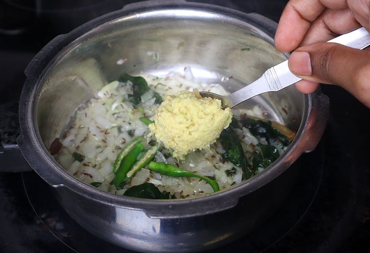 Step 1.2: Add green chillies, ginger and garlic paste, and sauté until the raw smell disappears