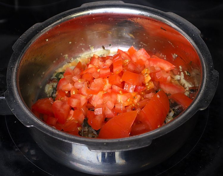 Step 1.2: Add chopped tomatoes and cook for a few minutes