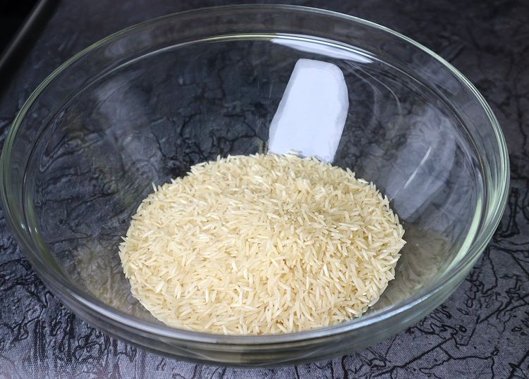 Step 1.3: Add basmati rice to a mixing bowl and rinse it 2-3 times