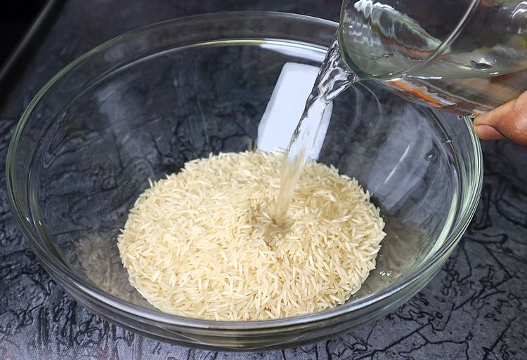 Step 1.4: Add basmati rice to a mixing bowl and rinse it 2-3 times
