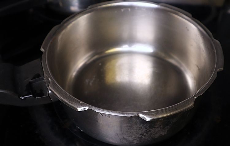 Step 1.1: In a heavy-bottom vessel or cooker, heat oil over medium to low flame
