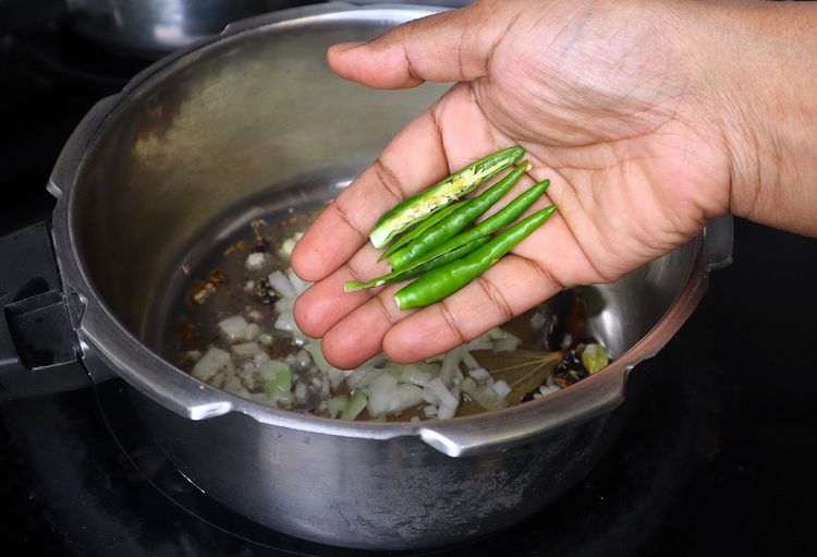 Step 1.1: Add Slit Green Chilli, coriander leaves, and mint leaves and sauté until fragrant