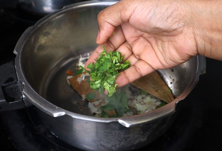 Step 1.3: Add Slit Green Chilli, coriander leaves, and mint leaves and sauté until fragrant