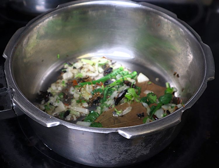Step 1.4: Add Slit Green Chilli, coriander leaves, and mint leaves and sauté until fragrant