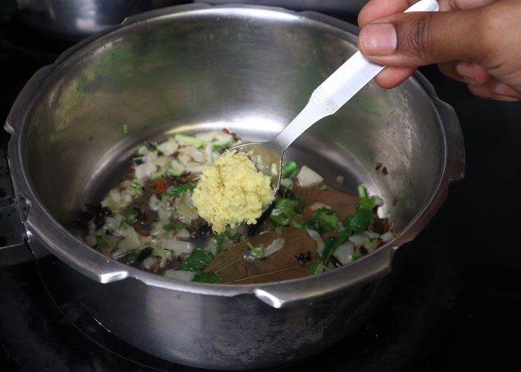 Step 1.1: Add ginger and garlic paste and sauté until the raw smell disappears