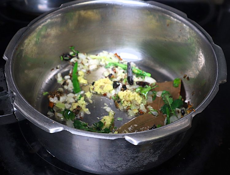 Step 1.2: Add ginger and garlic paste and sauté until the raw smell disappears