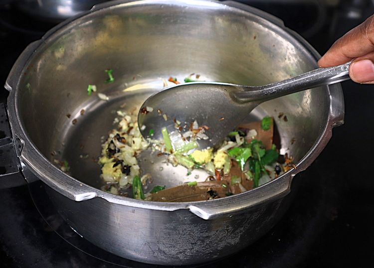 Step 1.3: Add ginger and garlic paste and sauté until the raw smell disappears