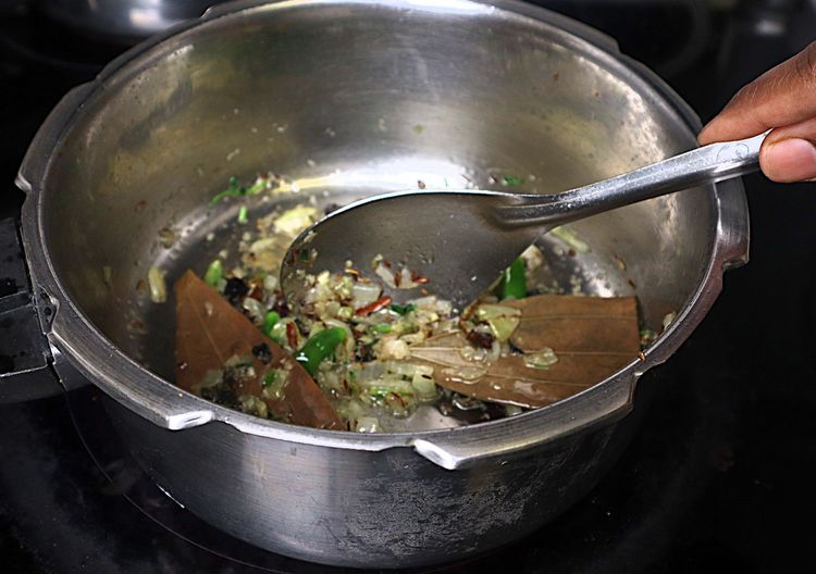 Step 1.4: Add ginger and garlic paste and sauté until the raw smell disappears