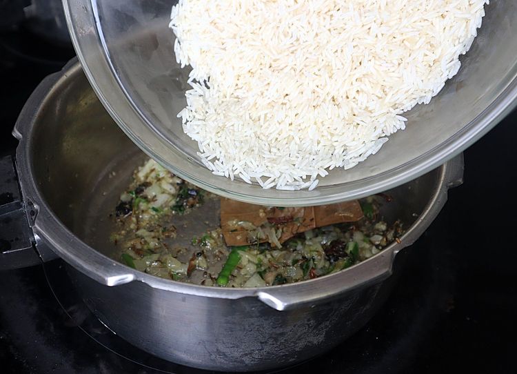 Step 1.1: Add soaked rice without water and sauté for 2 minutes