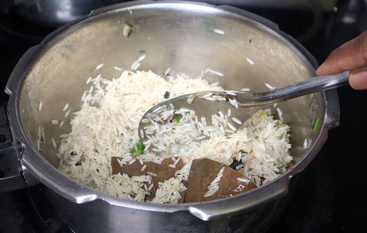 Step 1.3: Add soaked rice without water and sauté for 2 minutes