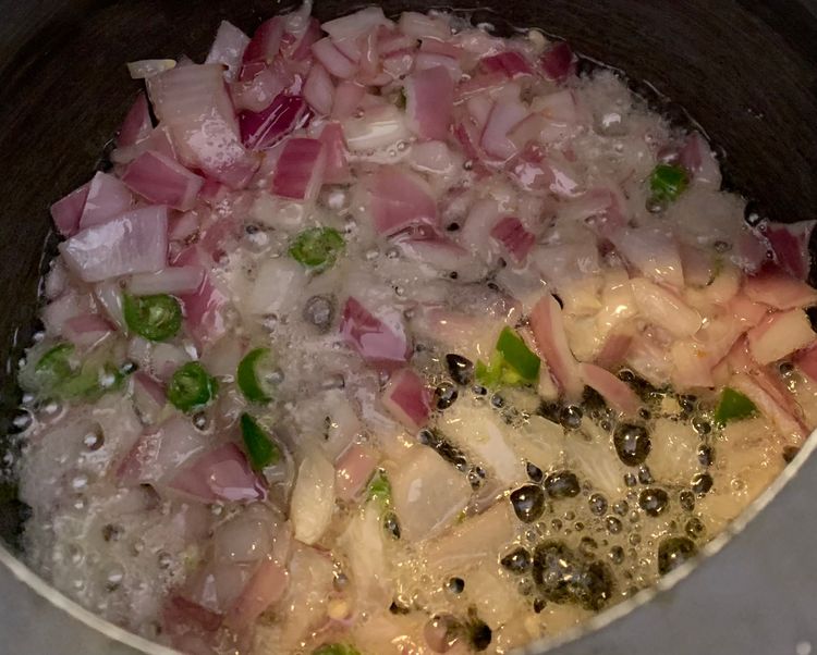Step 1.1: Add onions and green chillies to the pressure cooker