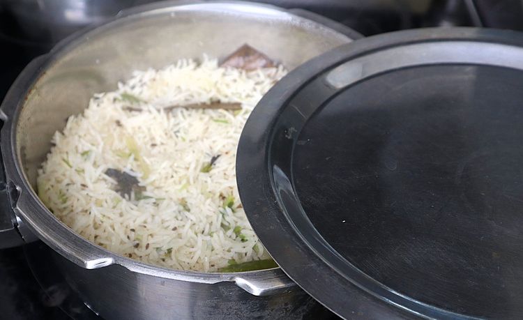 Step 1.1: Once the rice is cooked perfectly and grains are separated, you can add ghee for flavor