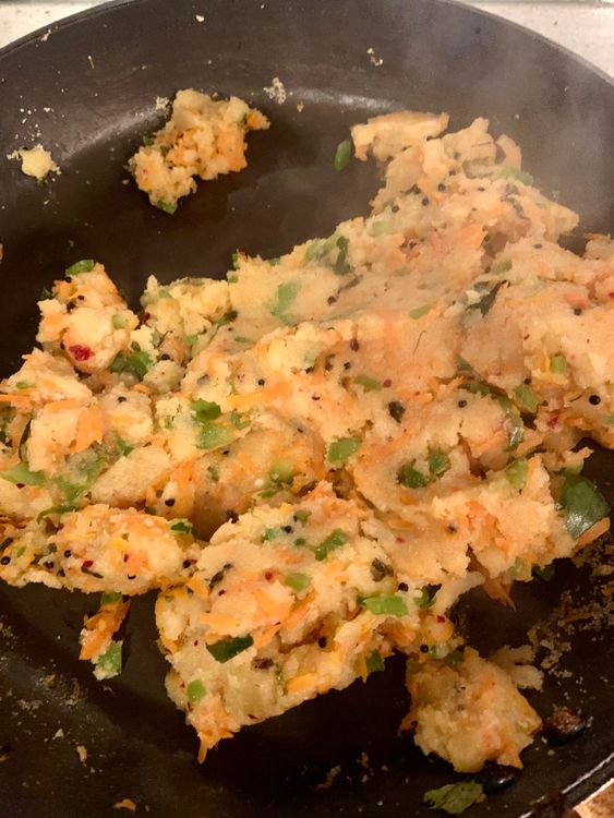 Step 1.1: Add the suji (semolina) and fresh coriander to the boiling mixture