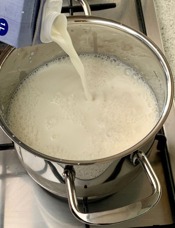 Step 1.1: In a deep pan, pour the milk and place it over medium-high heat