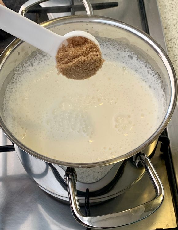 Step 1.1: Add the sugar and green cardamom powder to the milk